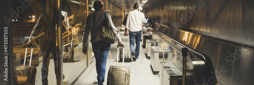 People travel and walking with luggages inside airport. Flights departures or arrival travelers in banner header size photo