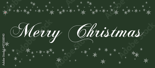 White lettering Merry Christmas with a lot of snowflakes on green background. Christmas traditional greeting card 
