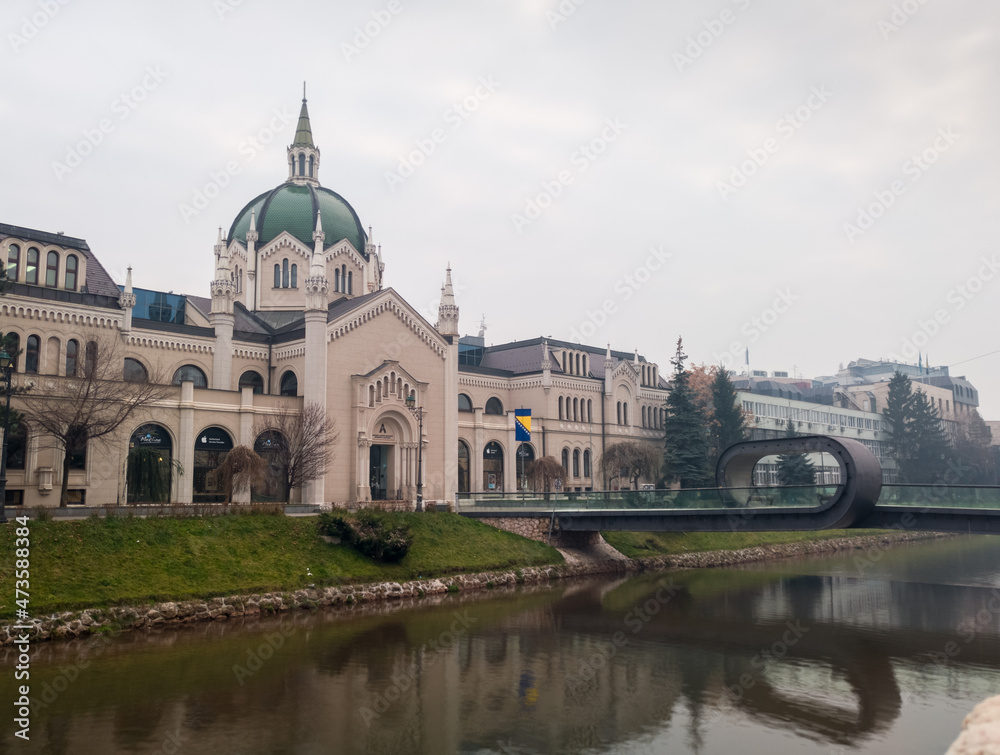 The building of the Academy of Fine Arts and the Festina Lenta Bridge over the Miljacka River in Sarajevo