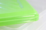 Plastic box with green lid and transparent box