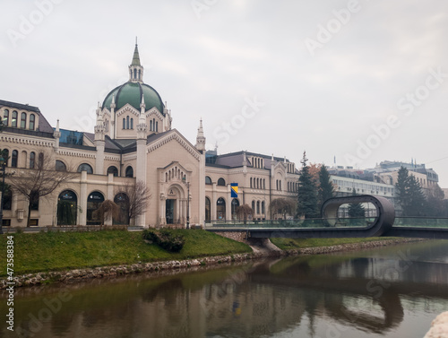 The building of the Academy of Fine Arts and the Festina Lenta Bridge over the Miljacka River in Sarajevo