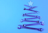 Christmas tree made of tools for Christmas. Blue background with Christmas tree