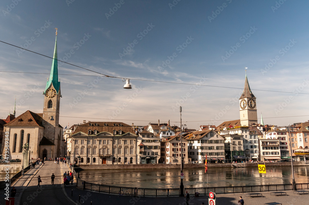 Obraz premium Zurich, Switzerland on October 20, 2012. Fraumunster Tower and St. Peter's Church, whose clock is the largest in Europe.