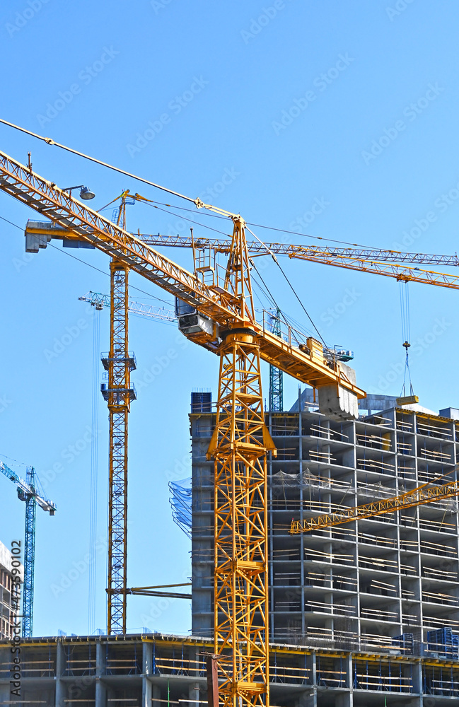 Crane and highrise construction site