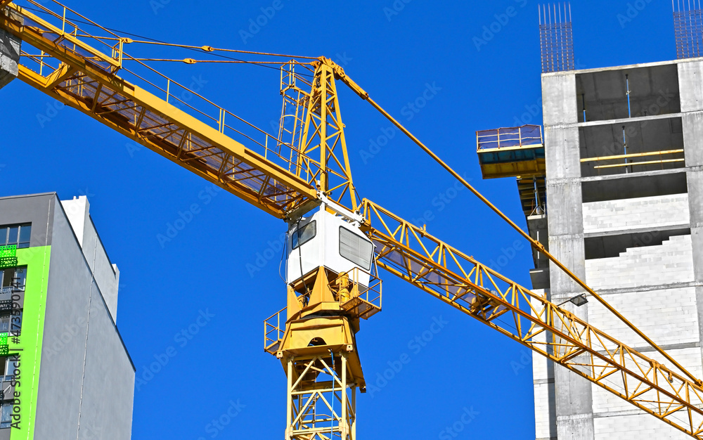 Crane and highrise construction site Crane and highrise construction site