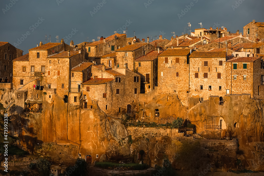 Medieval town of Pitigliano in Tuscany, Italy at sunset - architecture background