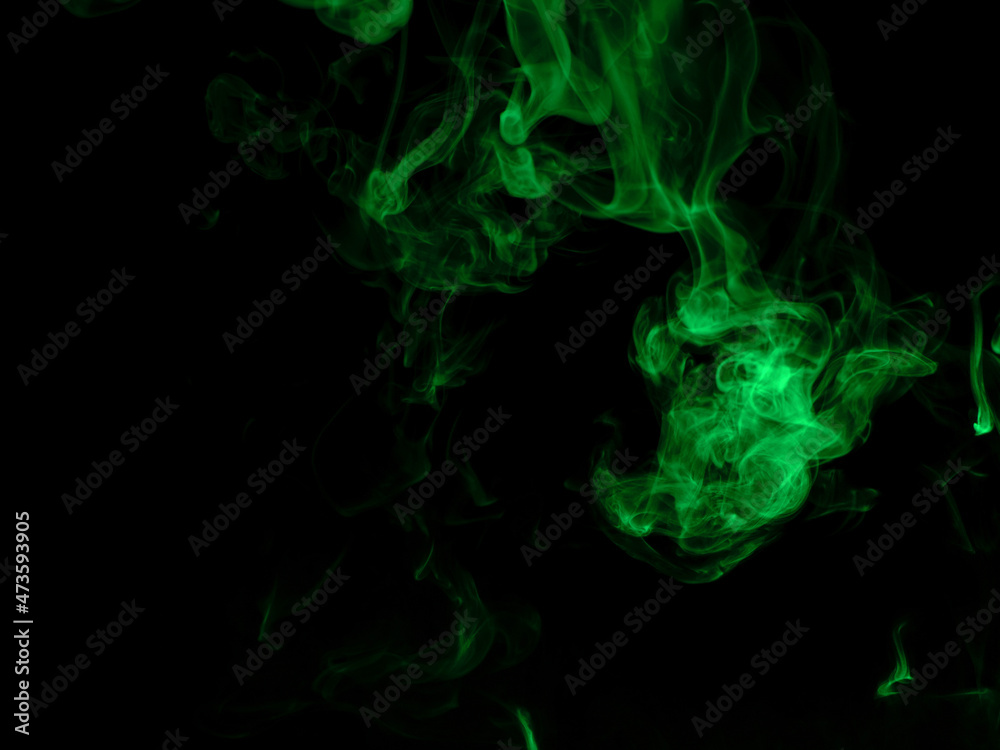 Chaotic mixing smoke creates abstract patterns on a black background