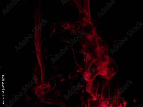 Chaotic mixing smoke creates abstract patterns on a black background