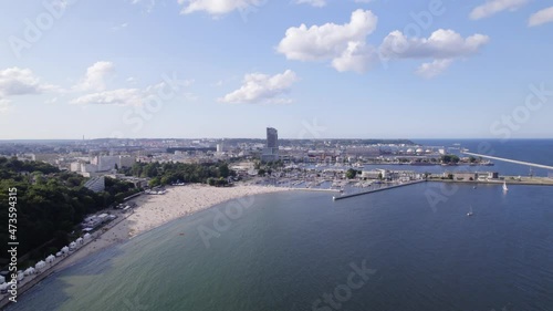 Gdynia city by the sea on a sunny day from a drone. Summer colors and sun rays in Gdynia.