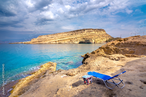 Matala beach with caves on the rocks that were used as a roman cemetery and at the decade of 70's were living hippies from all over the world, Crete, Greece