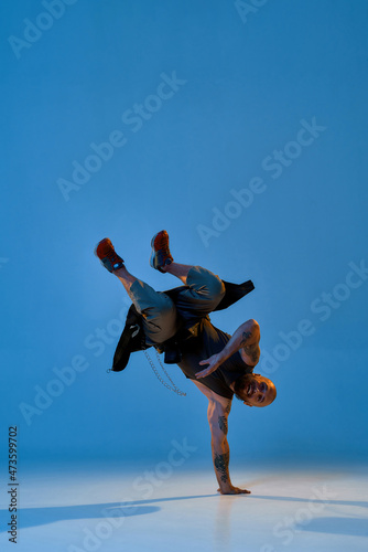 Young european male dancer dancing break dance