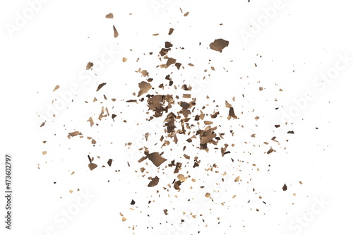 Ash with burned, cardboard scraps scattered, pieces explosion effect isolated on white background, texture, top view
