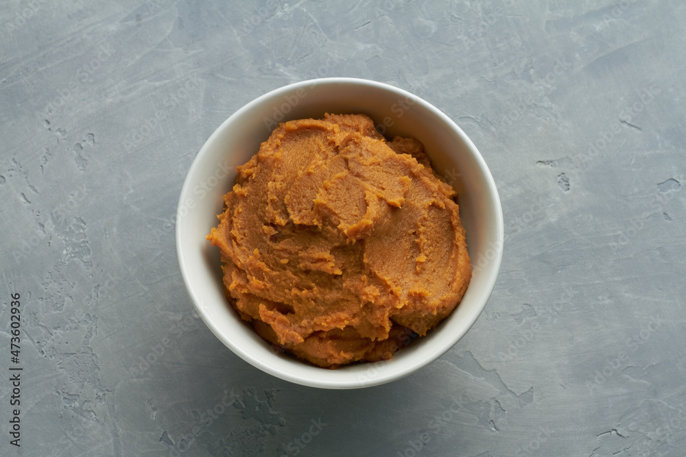 miso paste shiro miso in a bowl on grey background