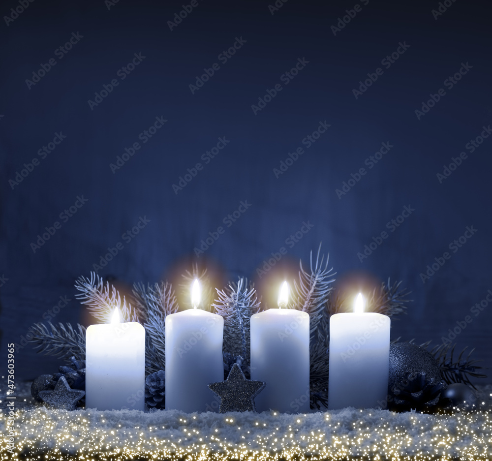 Four burning advent candles and luminous lights.