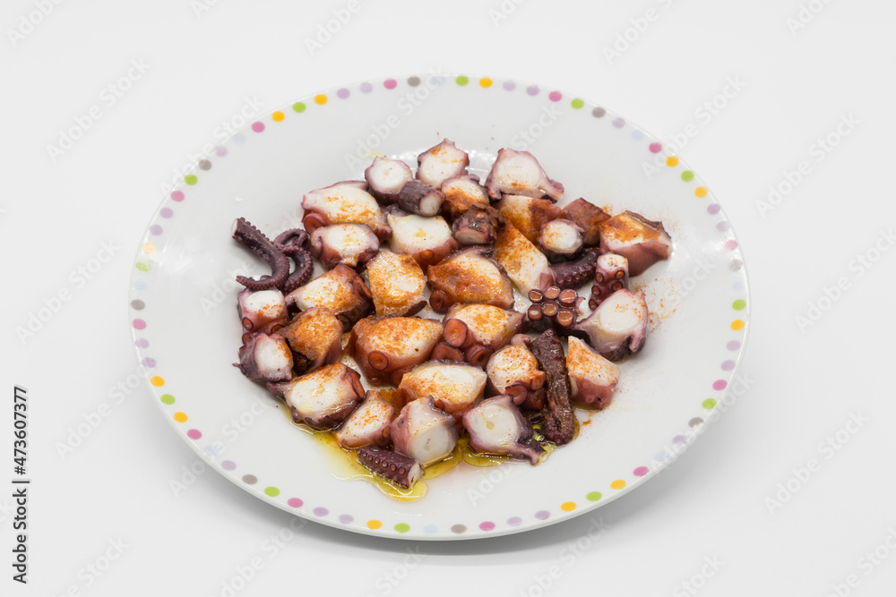 Galician octopus dish on white background Galician octopus dish on white background