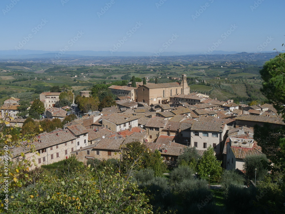 Panorama from the walkways of the castle of San Gimignano on the internal courtyard, on the surrounding landscape and on the towers of the old town
