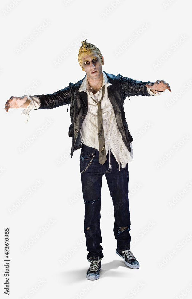 Full length portrait of a zombie looking into camera with a mindless stare and arms outstretched, against a white background Full length portrait of a zombie looking into camera with a mindless stare and arms outstretched, against a white background