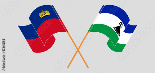 Crossed and waving flags of Liechtenstein and Kingdom of Lesotho