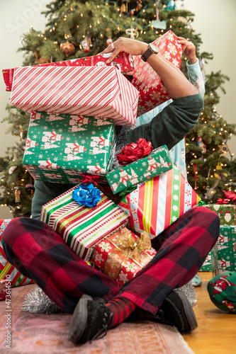 Family playing with presents on Christmas morning.  photo