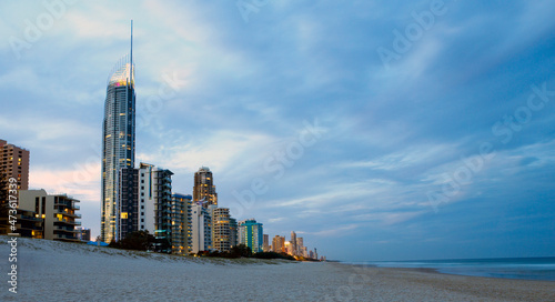 Resorts and apartments lining the edge of Surfers Paradise beach in the early evening photo