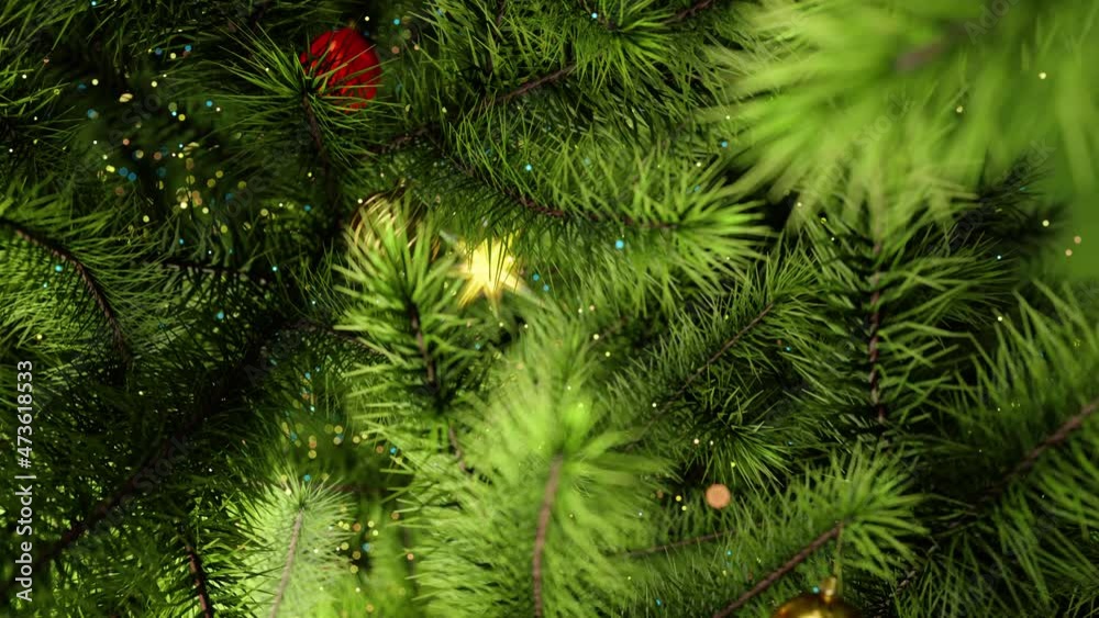 Close Up Christmas Tree With Star. A slow zoom-in with selective focus on a red ornament hanging on a festive Christmas tree. Close Up Christmas Tree With Star. A slow zoom-in with selective focus on a red ornament hanging on a festive Christmas tree.