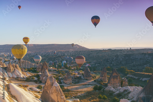 Hot air balloons flying over Cappadocia landscape, aerial view, Goreme National Park ,Turkey