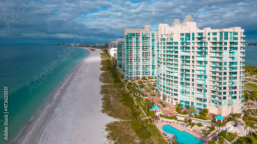 Panorama of City Clearwater Beach FL. Spring break or Summer vacations in Florida. Beautiful View on Hotels and Resorts on Island. Turquoise color Ocean water. American Coast or shore Gulf of Mexico.