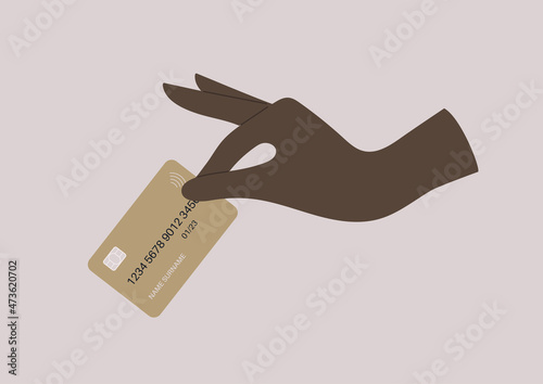 A premium level client, a hand holding a golden plastic bank card