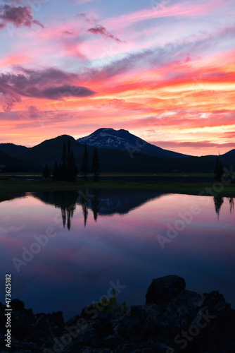 Bend Oregon Sparks Lake with vibrant sunrise clouds and reflections