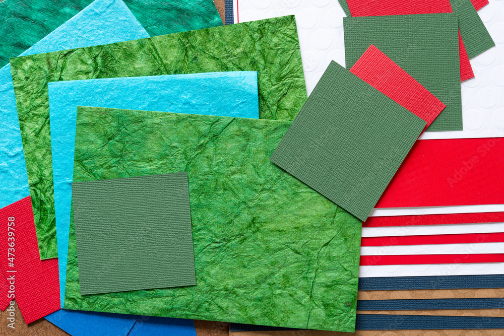 abstract paper background in green, blue, red, white, and brown abstract paper background in green, blue, red, white, and brown