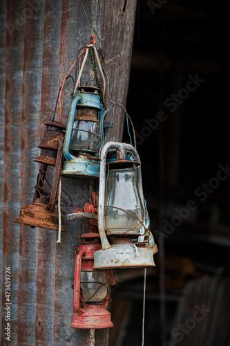 A group of old hurricane lamps