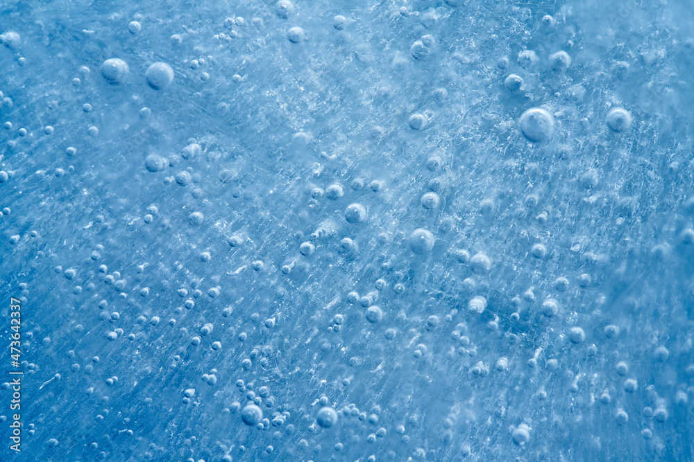 Closeup photo of blue ice with bubles