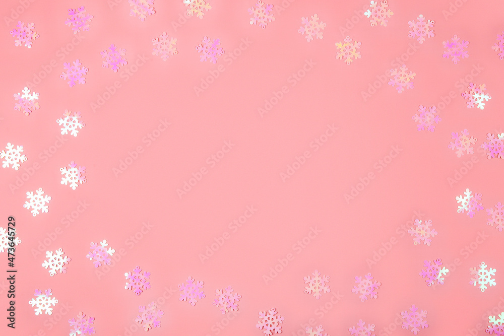 Abstract Christmas background in pink. Pink confetti on a pink background, copy space for text Abstract Christmas background in pink. Pink confetti on a pink background, copy space for text