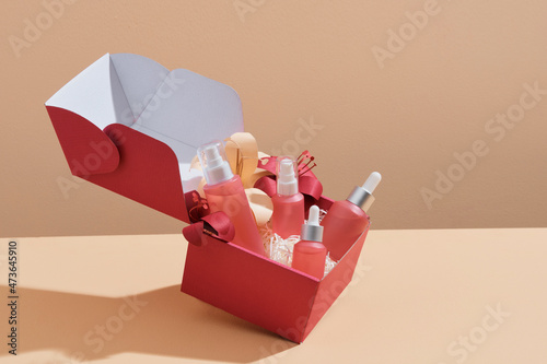 Open large gift box filled with cosmetics.  photo