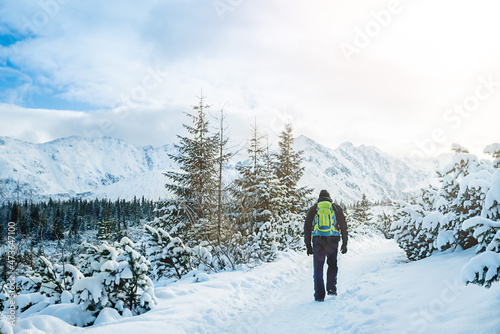 Man hiking in mountains in winter, Zakopane