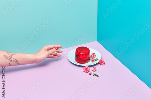 Woman reaching out to gelatin dessert photo