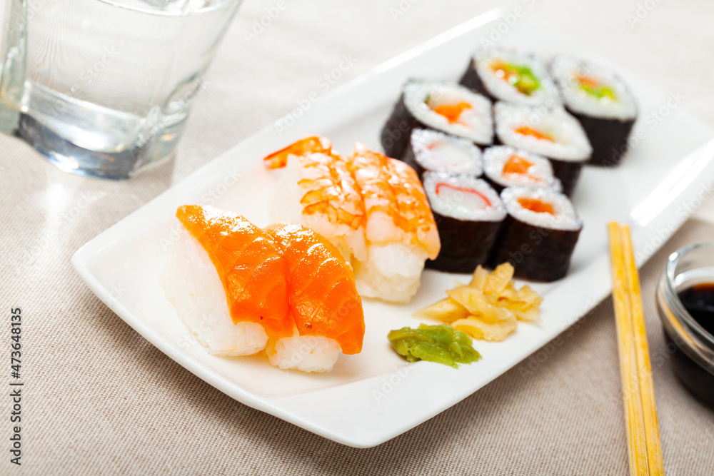 Various of nigiri and hosomaki sushi traditionally served with wasabi and soy sauce. High quality photo