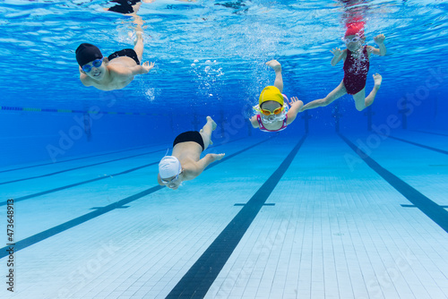 fours kids swimming 
