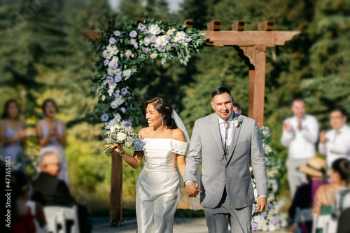 Bride and Groom Walking down Aisle after Ceremony photo