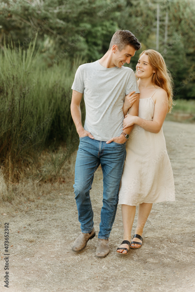 Man holding woman while walking Man holding woman while walking