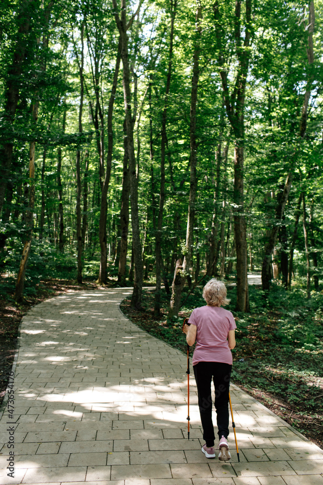 Senior woman trekking in park
