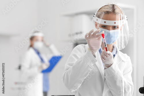 Scientist with sample of co...