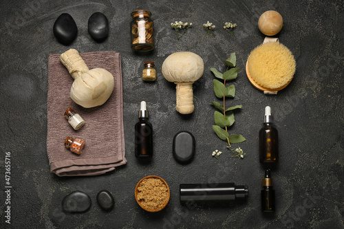 Composition with natural cosmetics and spa accessories on dark background