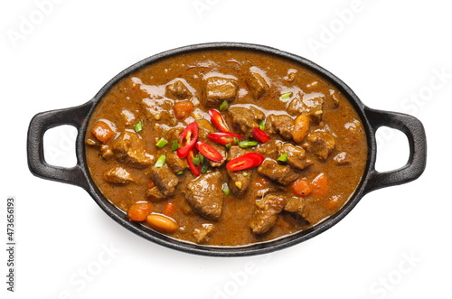 Dish with tasty beef curry on white background