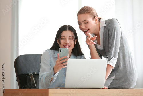 Female colleagues gossiping...