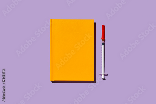 syringe and notebook