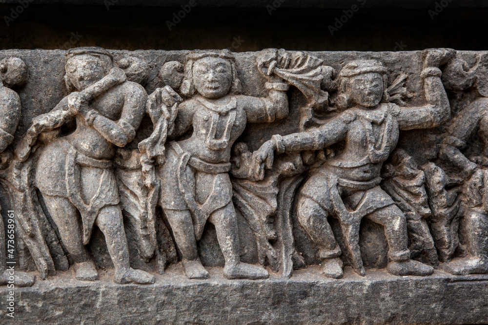 The sculptures of musicians and dancers on the exterior walls of Hoysaleshwara temple at Habebid, Karnataka, India.