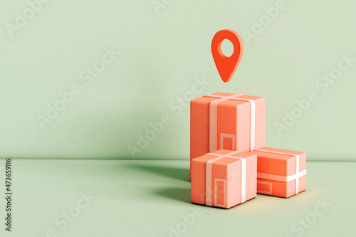 Cardboard boxes  with map pin on green background photo