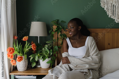 Young woman in the bedroom  photo