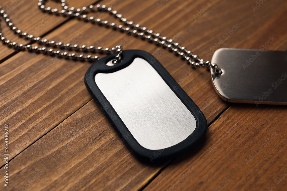 Fototapeta premium Military dog tags on wooden background